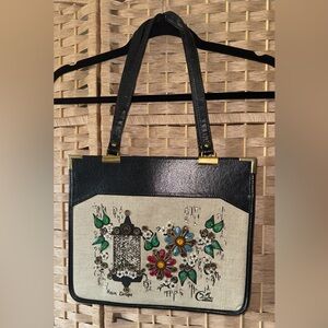 Elegant Black and Cream Shoulder Bag with Vintage Birdcage Design